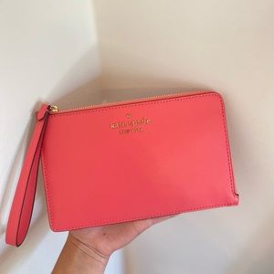 Bright pink Kate Spade wristlet